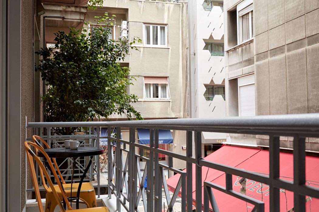 Quiet balcony with view on the pedestrian street